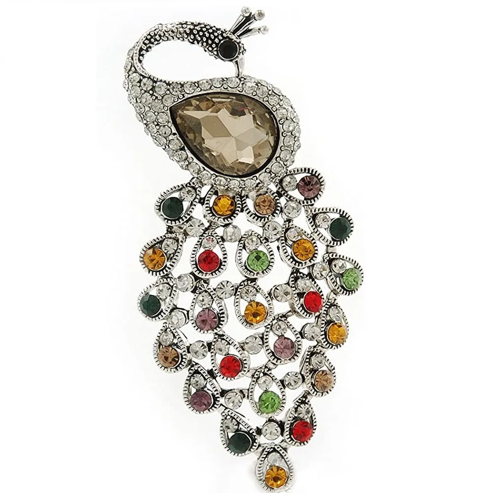 Broche Avalaya de pavo real multicolor con centro champán