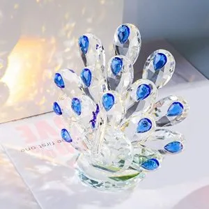 Figura Movdyka de pavo real transparente con detalles azules