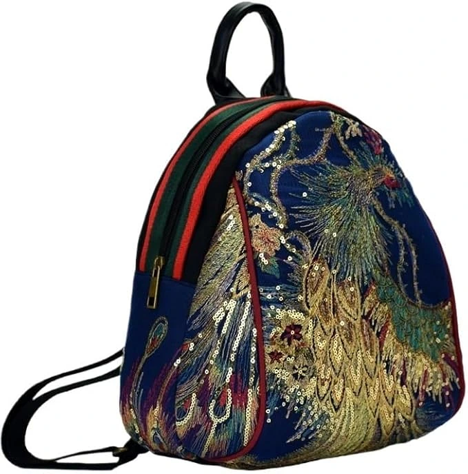 Mini mochila YOPI azul con pavo real bordado
